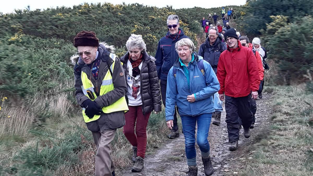 Photo with leader and back marker wearing hi-vis tabards