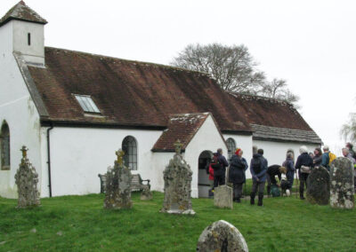 Photo of group of walkers outside the Church of All Saints, Chalbury – March 16, 2024