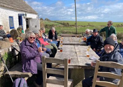 Photo of happy people outside the Square & Compass after the Emmets Hill walk – March 23, 2024