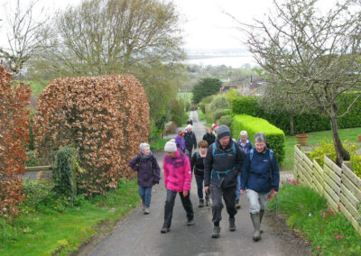 Photo of walkers passing through the Glebe Estate on the way to Ballard Down – April 3, 2024