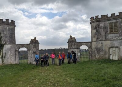 Photo of walkers passing the derelict North Lodges, Lulworth Castle, Coombe Keynes – April 24, 2024