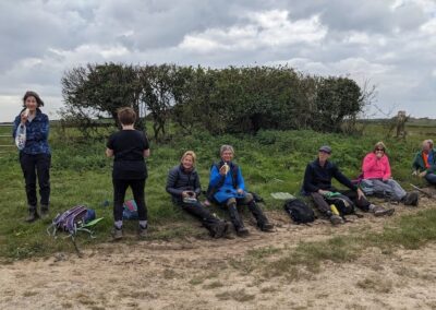Photo of walkers taking a break during the 10-mile Winfrith Newburgh to West Lulworth walk – April 24, 2024