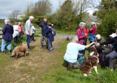 Photo of walkers during a break at the top of West Street in Corfe Castle – April 27, 2024