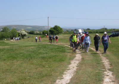 Photo of walkers approaching Acton – May 14, 2025