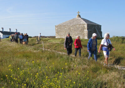 Photo of walkers passing St Aldhelm's Chapel – June 2, 2025
