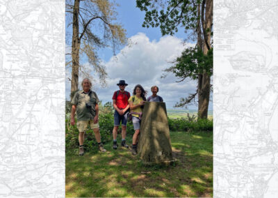 Group photo taken at the trig point on Penbury Knoll – June 4, 2025