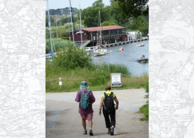 Photo of two walkers approaching the River Frome at Redcliffe – June 21, 2025