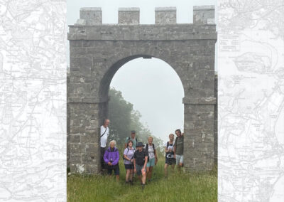 Group photo taken at Grange Arch, an 18th century folly – June 28, 2025