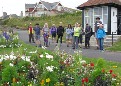 Photo of walkers on Weymouth seafront – July 5, 2025
