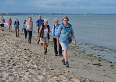 Photo of walkers on Studland beach – July 17, 2025