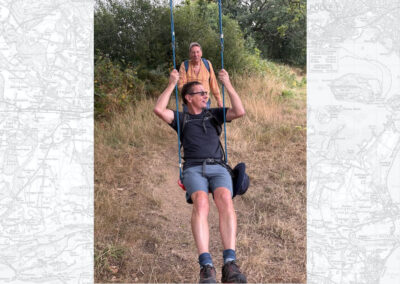 Photo of two walkers having fun on a tree swing – August 13, 2025