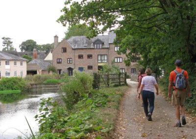 Photo of walkers passing through Bickton – August 20, 2025
