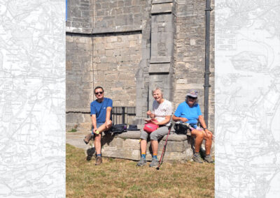 Photo of walkers at the church of St. Edward, King and Martyr at Corfe Castle – August 23, 2025