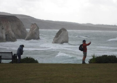 Isle of Wight HF Holiday: Photo of group members against a backdrop of a rough sea – September 5, 2025