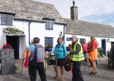 Photo of walkers outside the Square & Compass public house – October 1, 2025