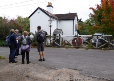 Walkers near a railway cottage and level crossing gate on the old Somerset and Dorset Railway (the line closed to passengers in 1966) – October 11, 2025