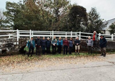 Photo of walkers standing in a dry "ford" at Tarrant Monkton – October 18, 2025