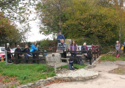 Photo of walkers at the memorial on the site of the Tarrant Rushton airfield (operational from 1943 to 1980) – October 18, 2025 