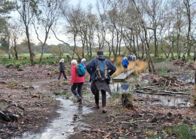 Photo of walkers tackling waterlogged ground – November 12, 2025