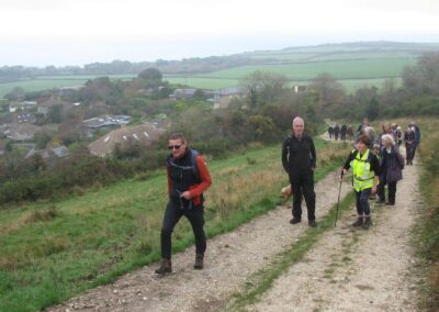Photo of walkers climbing back onto Ballard Down from the Studland side – November 15, 2025