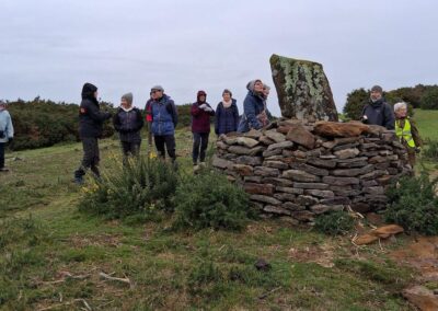 Photo of walkers by a commemorative cairn on Stoborough Heath – December 17, 2025