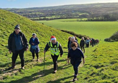 Photo of walkers climbing West Hill – December 20, 2025