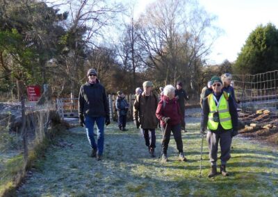 Photo of walkers just after crossing the railway near Cats Eye Cottage – January 3, 2026
