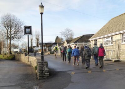 Photo of walkers passing the Village Inn in Ulwell – January 7, 2026