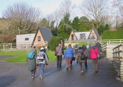 Photo of walkers approaching "Pod Village" at Ulwell Holiday Park – January 7, 2026