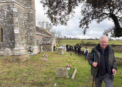 Photo of walkers passing Whitcombe Church – January 17, 2026