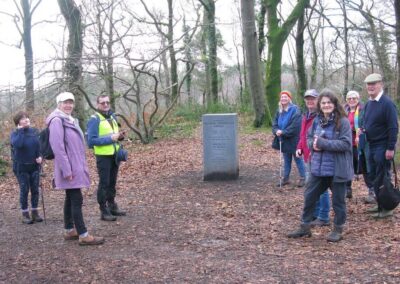 Photo of walkers at the memorial erected by the Airfields of Britain Conservation Trust dedicated to those who served at RAF Warmwell (Woodford) between 1937 and 1946 – January 17, 2026