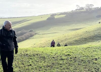 Photo of walkers climbing Combe Hill – February 11, 2026