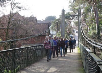 Photo of group crossing Alum Chine on the suspension bridge – February 25, 2026