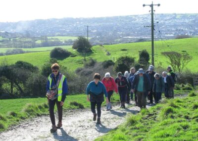 Photo of walkers heading towards the base of Nine Barrow Down – March 14, 2026