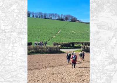 Photo of walkers picking their way along a ploughed footpath – March 21, 2026