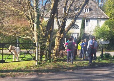 Photo of walkers approaching journey's end at Milton Abbas – March 21, 2026