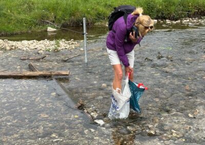 Photo of walker negotiating a shallow stream near a broken footbridge – May 6, 2026