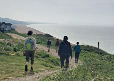 Photo of walkers heading for Cogden beach – May 9, 2026