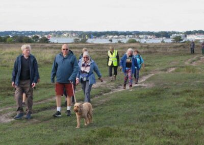 Photo of walkers with Poole Harbour in the background – May 11, 2026