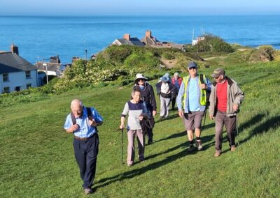 Photo of walkers climbing up The Downs from Peveril Point – May 21, 2026