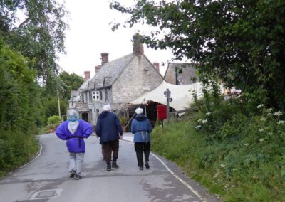 Photo of walkers with Bankes Arms in background – June 11, 2026