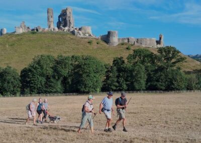 Photo of walkers with Corfe Castle in the background – July 9, 2026