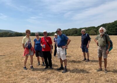 Group photo taken in a scorched looking field on the way to Norden – July 22, 2026