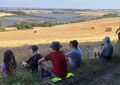 Group photo looking out over North Farm Solar Farm – July 25, 2026