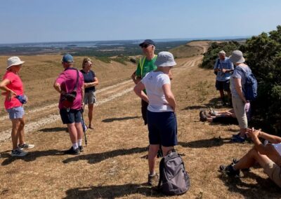 Group photo taking on the ridge above Church Knowle – July 29, 2026