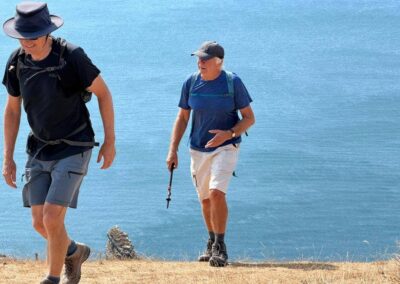 Photo of walkers against a backdrop of a brilliant blue sea – August 15, 2026