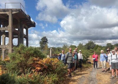 Group photo next to one of the gun towers on Holton Heath – August 19, 2026