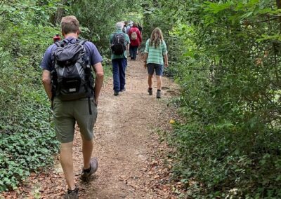 Photo of walkers on a path in the woods – September 5, 2026