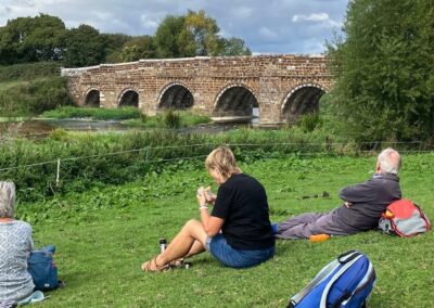 Photo taken at rest break with the striking Mill Bridge in the background – September 16, 2026