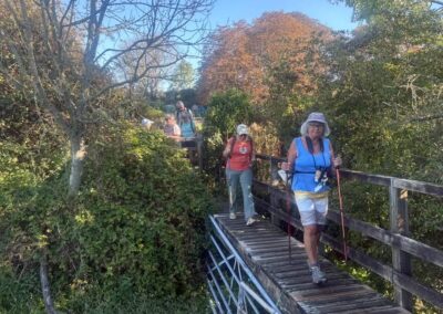 Photo of walkers crossing the footbridge on the way to Bradford Peverell – September 23, 2026